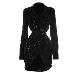 Detail of black sequined mini dress featuring cross V-neck and waist cutout design