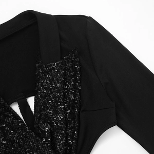 Detail of black sequined dress with lapel collar and stylish cutout design for parties