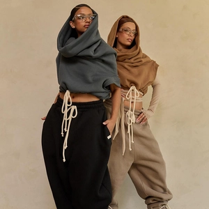 Women's cropped hooded sweatshirt and baggy jogger set with thick drawstring detail