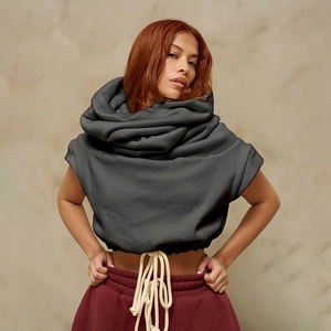 Close-up of deep grey oversized draped neck sleeveless hoodie with thick cream drawstrings