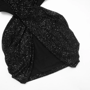 Close-up of elegant black sequins on fabric with cross-over stitching and smooth lining