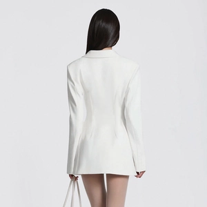 Back view of a white slim fit blazer dress showing elegant vertical seams and flared hem