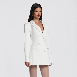 Detail of the white double-breasted blazer dress with notched lapels and flap pockets