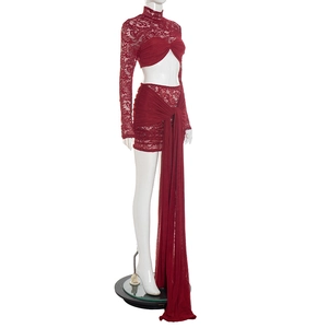 Detail of burgundy lace long sleeve crop top and mini skirt with long ribbon tie