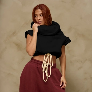 Detail of black sleeveless hoodie featuring contrast drawstring and high cowl neckline