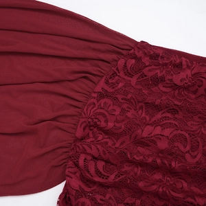 Detail of burgundy lace and pleated chiffon fabric stitching on the two-piece set