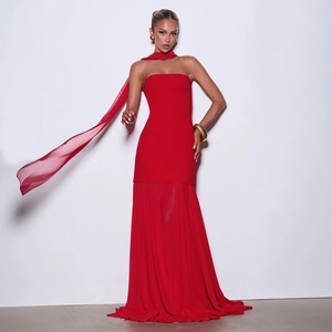 Detail of red strapless maxi dress featuring a chiffon spliced pleated hem and matching scarf