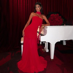 Elegant red chiffon evening gown featuring a strapless bodice and long decorative neck streamer
