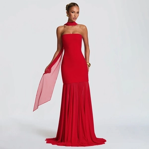 Detailed view of red mermaid evening dress with pleated mesh hem and matching scarf neck tie