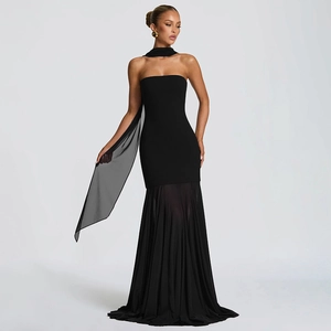 Detailed view of elegant black strapless evening dress with sheer pleated chiffon skirt