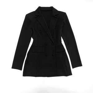 Detail of slim fit black double-breasted blazer dress with notched lapels and pockets
