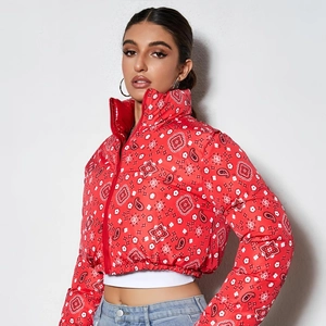 Women's reversible bandana print puffer jacket in vibrant red with a stylish stand collar