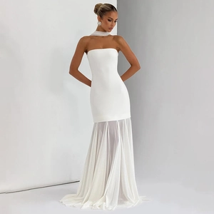 Close-up of white strapless fisheye gown with sheer mesh chiffon hem and scarf detail