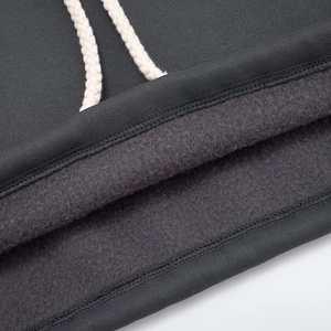 Detail view of the soft fleece lining and thick white drawstring on a dark grey hoodie