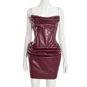 Detail of burgundy PU leather corset dress with ruched textures and fishbone structure