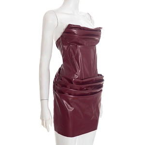 Detailed side view of burgundy PU leather mini dress with boned bodice and pleated hem