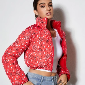 Detailed shot of red paisley bandana print and high stand-up collar on the puffer jacket