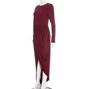 Close-up of wine red slim maxi dress showing the asymmetric draped hem and side slit