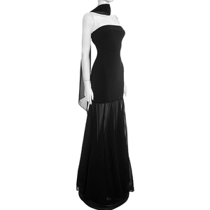 Detail of elegant black strapless evening gown featuring sheer chiffon mermaid hemline