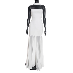 Detail of white strapless maxi dress featuring pleated chiffon hem and neck scarf