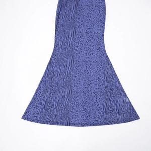 Detail of purple animal print flared hem featuring zebra and leopard patchwork texture
