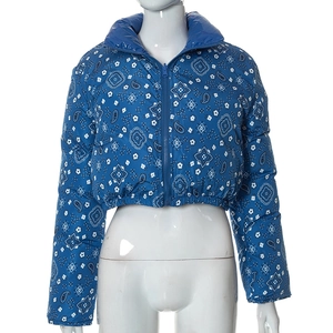 Detailed view of cropped blue jacket with white paisley print and windproof stand collar