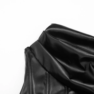 Close-up of black PU leather dress with boning details and elegant ruched bodice design