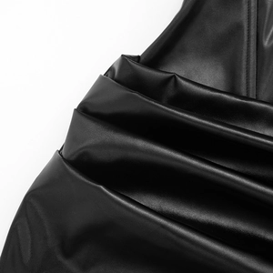Detail shot of the black PU leather fabric with elegant pleats and ruched texture