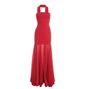 Detail of red halter neck dress featuring pleated chiffon fishtail skirt and bodycon fit
