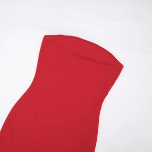 Detail of elegant red strapless dress with seamless stitching and fine fabric texture