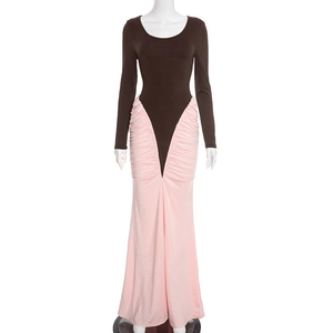 Detail view of contrast color long sleeve dress featuring waist ruching and brown top