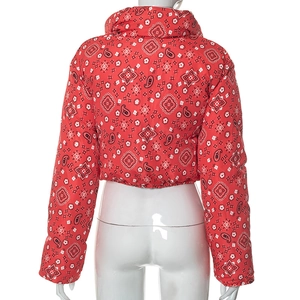 Detail view of red bandana print cropped puffer jacket with elastic hem on mannequin