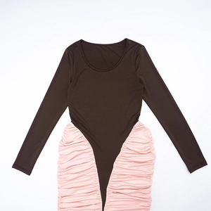 Detail view of the elegant two-tone dress featuring ruched pink fabric and brown sleeves