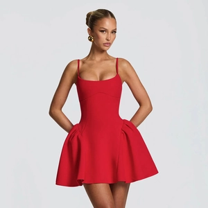 Detail view of the red sleeveless A-line dress with pleated skirt and slimming cut
