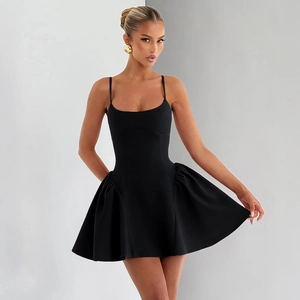 Detail of a minimalist black camisole dress with adjustable straps and flared hemline