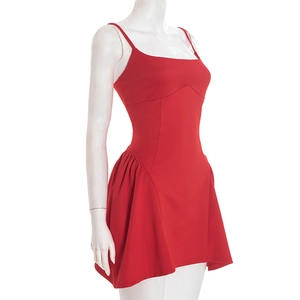 Detail view of red mini dress featuring spaghetti straps and side ruched ruffle design