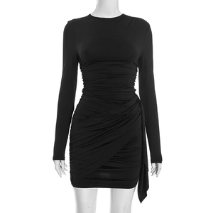 Close-up of ruched fabric details and asymmetric wrap hem on a black bodycon dress