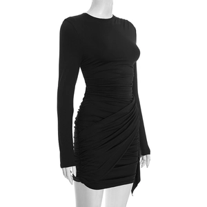 Detail of ruched black mini dress showing stretch fabric texture and asymmetric wrap hem