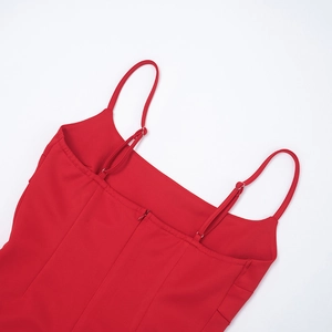 Detail of red camisole back featuring adjustable straps and a hidden zipper closure