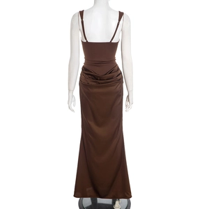 Detail of elegant chocolate brown satin maxi dress showing back pleats and fishtail hem