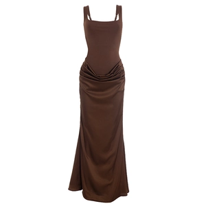 Detail of adjustable metal buckle on brown sleeveless satin dress with pleated texture