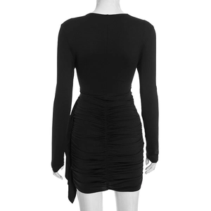 Detail view of ruching process and back texture on a slim fit black long sleeve dress