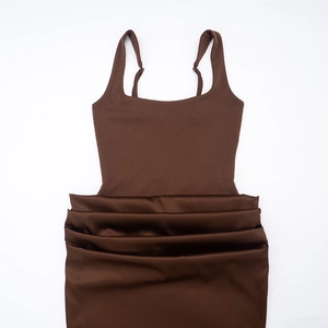 Detail of square neck sleeveless dress showing stretchy dark brown ribbed fabric texture