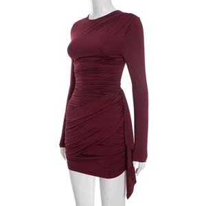 Detail of burgundy ruched bodycon dress with side draping and asymmetric wrap hemline