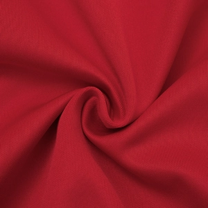 Macro detail of red knitted fabric texture with soft drapes for sleeveless dress