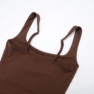 Detail of elegant dark brown square neck dress with adjustable thin shoulder straps
