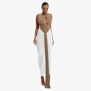 Detail of contrast halter dress with keyhole cutout and elegant flowing white pleated skirt