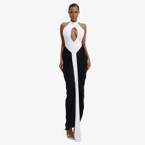 Chic black and white halter maxi dress with cutout detail and pleated slit skirt