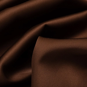 Macro shot of dark brown satin fabric showing luxurious silky texture and elegant sheen
