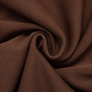Close-up of dark coffee ribbed knit fabric showing soft texture and elastic weave
